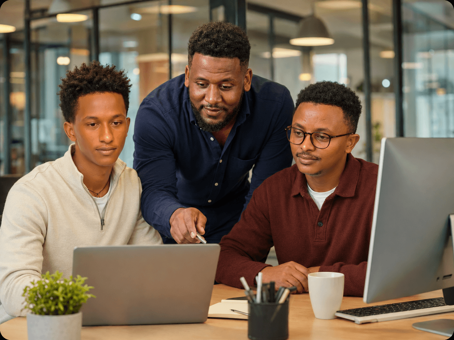 Team reviewing digital product strategy on a laptop
