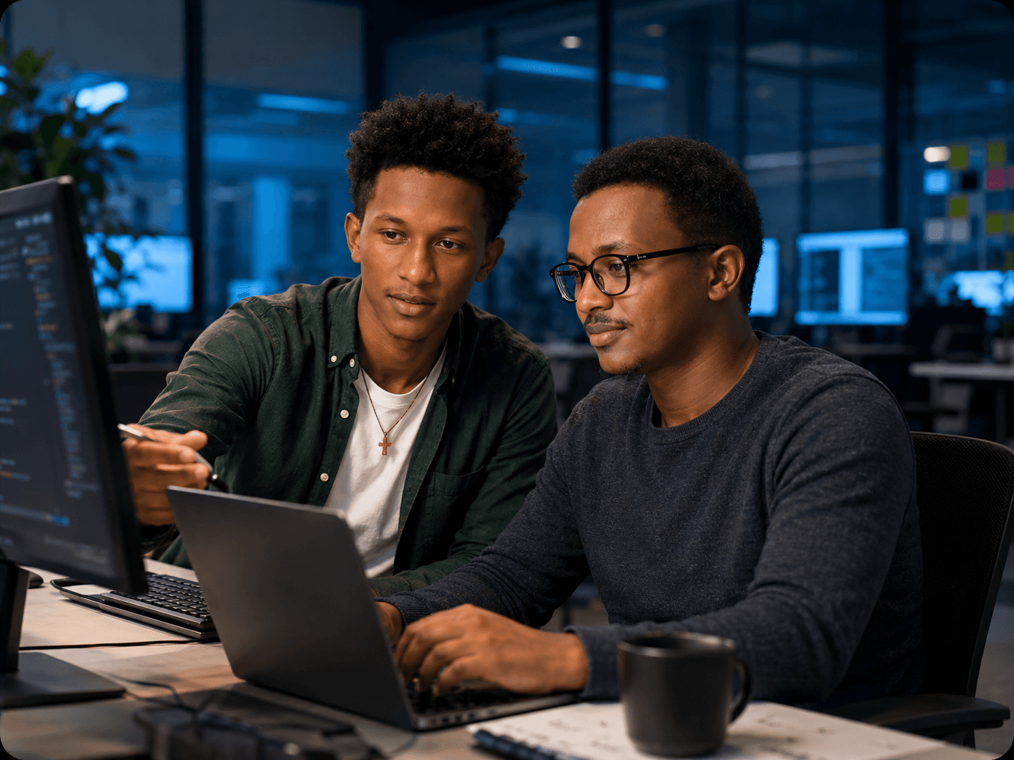 Technology team working with computers in an office