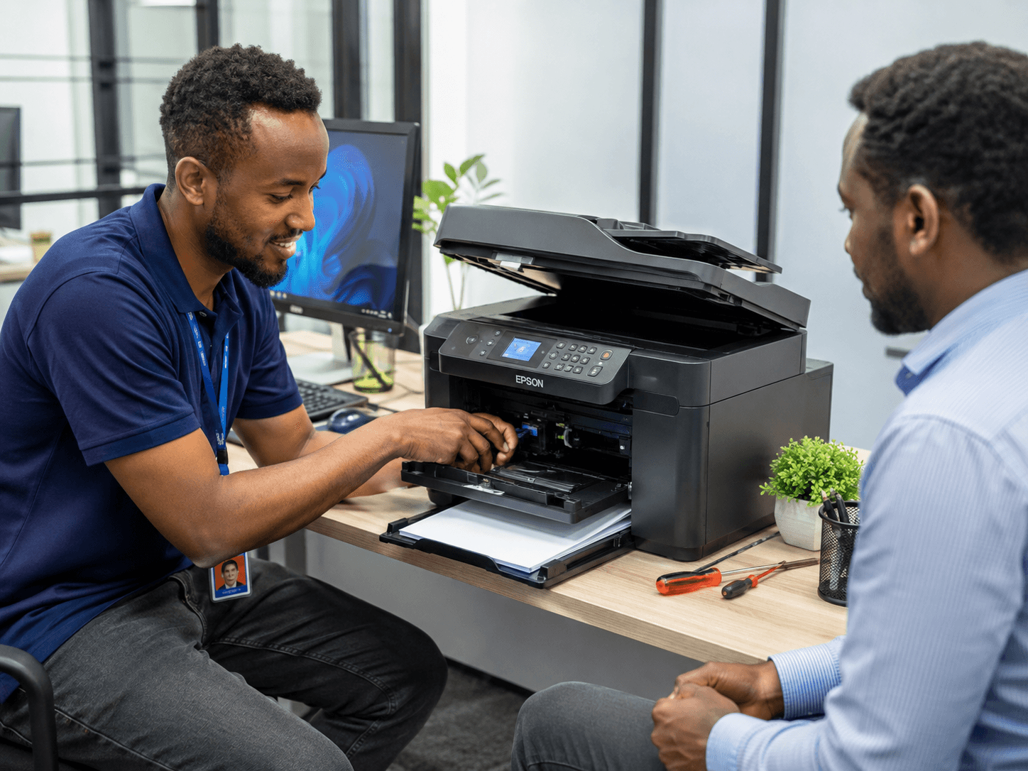 Technician repairing desktop hardware onsite