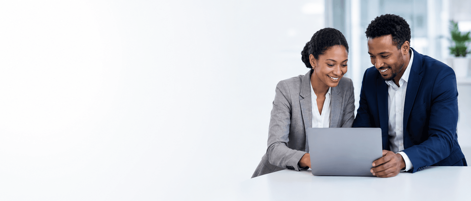 Business consultants reviewing a project tablet